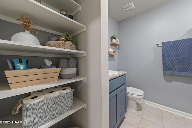 half bathroom with visible vents, baseboards, toilet, tile patterned flooring, and vanity