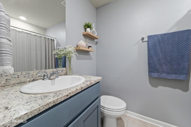 full bathroom featuring tile patterned flooring, baseboards, vanity, and toilet