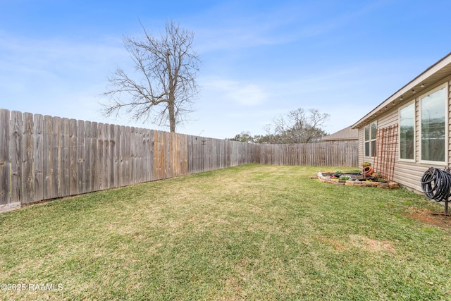 view of yard with a fenced backyard