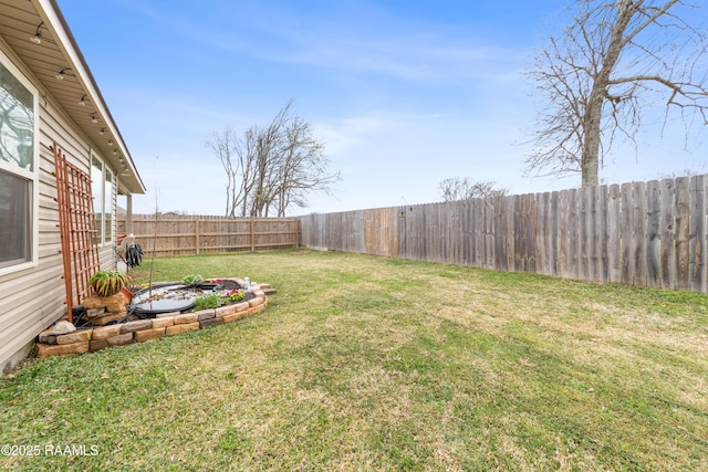 view of yard with a fenced backyard