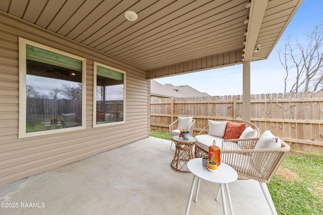 view of patio featuring fence