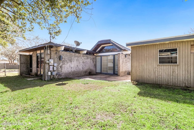 back of house with a yard, a patio, and fence