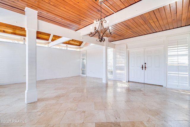 interior space featuring a chandelier and wooden ceiling