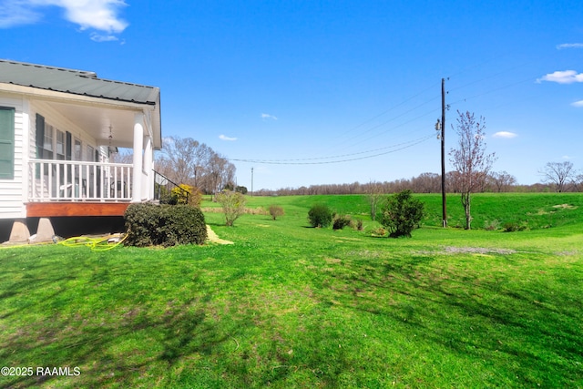 view of yard with a rural view