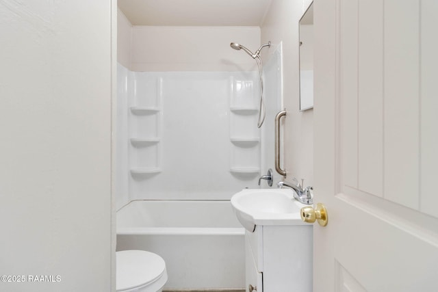 bathroom featuring toilet, shower / bathing tub combination, and vanity