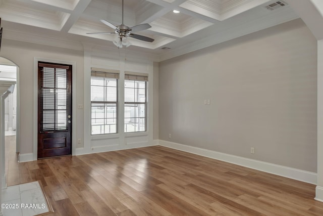 interior space featuring arched walkways, light wood-style flooring, coffered ceiling, visible vents, and beamed ceiling