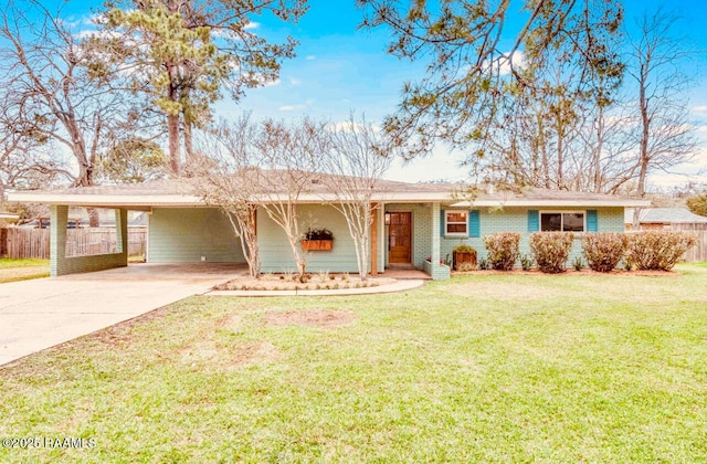 ranch-style house featuring driveway, fence, a front yard, a carport, and brick siding