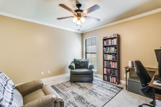 office space featuring carpet floors, baseboards, a ceiling fan, and crown molding