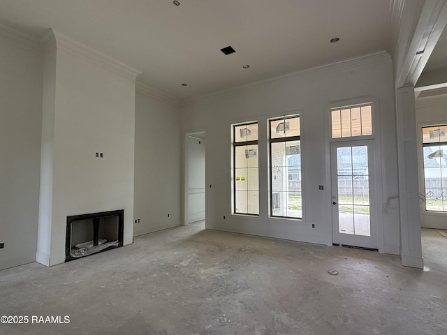 unfurnished living room with ornamental molding, a healthy amount of sunlight, and a fireplace