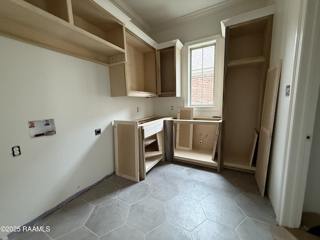 clothes washing area with electric dryer hookup, ornamental molding, washer hookup, and laundry area
