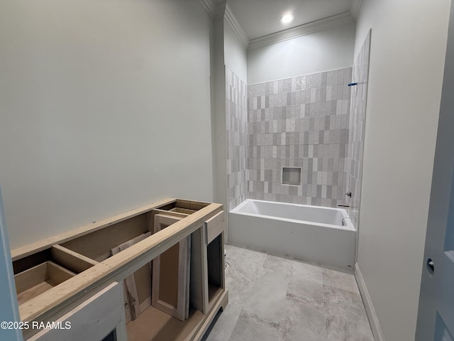bathroom with ornamental molding and tub / shower combination