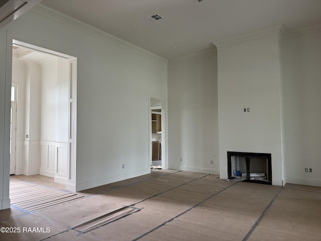 unfurnished living room featuring ornamental molding, a fireplace, and visible vents