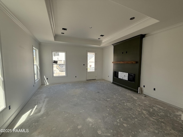 unfurnished living room with baseboards, a raised ceiling, visible vents, and crown molding