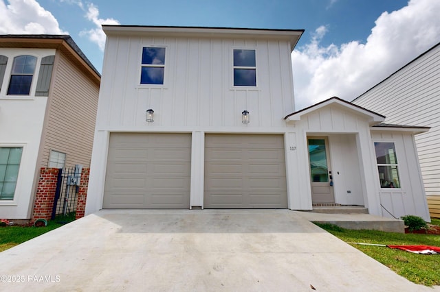 117 Chimney Rock Blvd, Lafayette, LA 70508 - view of front of property with an attached garage, board and batten siding, and concrete driveway