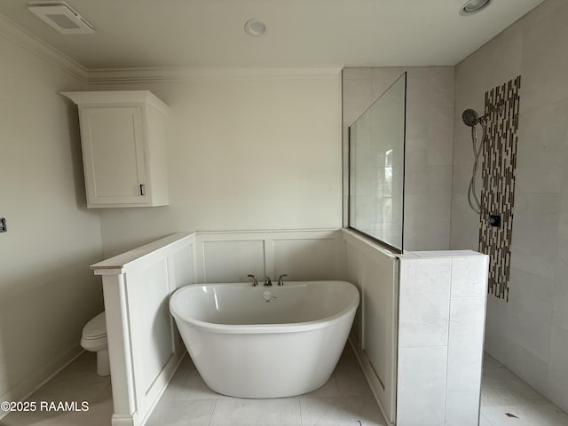 bathroom with crown molding, a freestanding tub, toilet, and a walk in shower