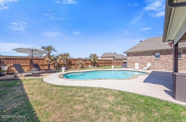 view of pool featuring a fenced in pool, a patio area, a yard, and a fenced backyard