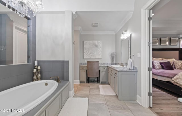 ensuite bathroom with baseboards, ensuite bathroom, a garden tub, crown molding, and vanity