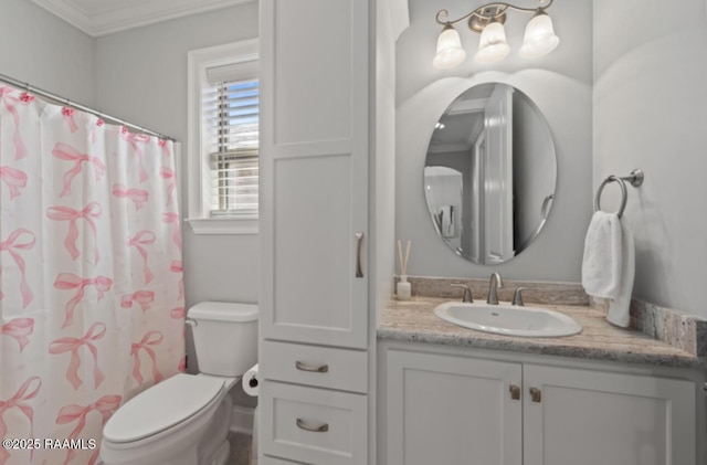 full bathroom featuring ornamental molding, a shower with shower curtain, vanity, and toilet