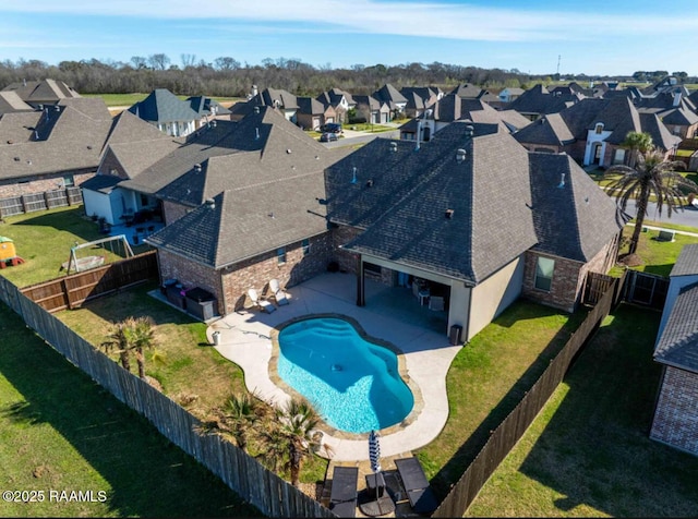 birds eye view of property with a residential view