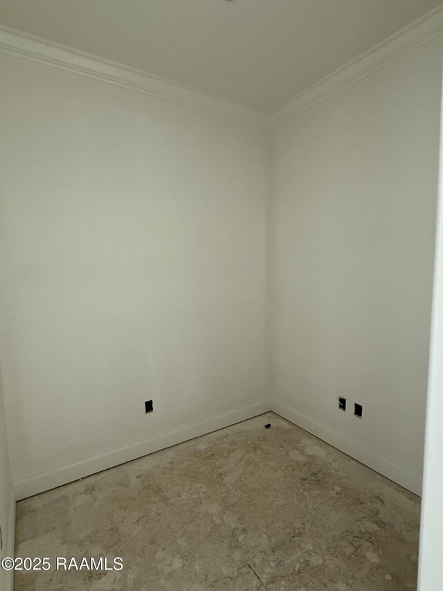 unfurnished room featuring baseboards, concrete floors, and ornamental molding