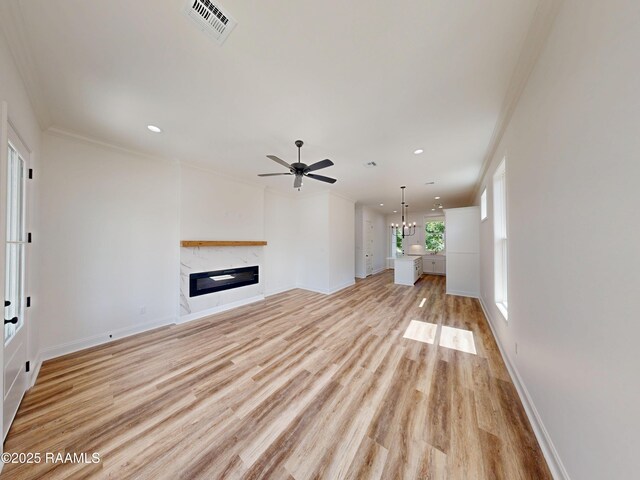 119 Chimney Rock Blvd, Lafayette, LA 70508 - unfurnished living room with light wood-type flooring, a high end fireplace, ornamental molding, a ceiling fan, and recessed lighting