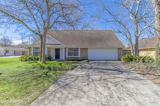 view of front of house with brick siding, a shingled roof, an attached garage, driveway, and a front lawn