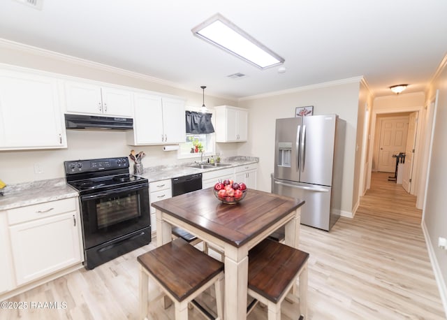 kitchen with light wood-style flooring, black appliances, white cabinets, under cabinet range hood, and crown molding