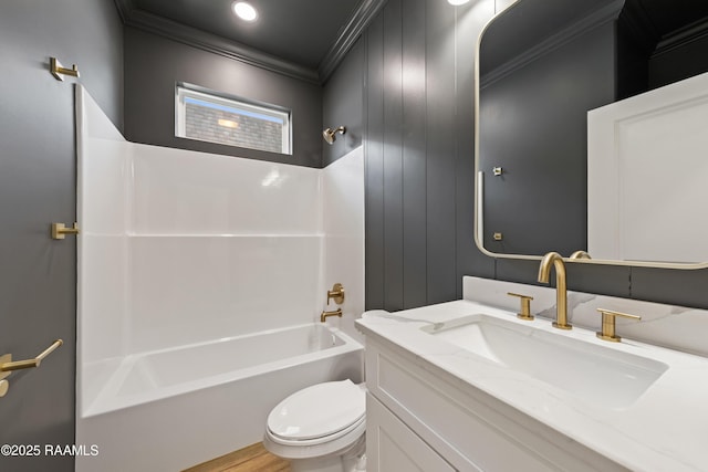 full bathroom with ornamental molding,  shower combination, vanity, and toilet