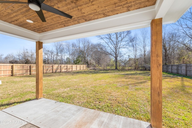 view of yard with a patio area, a fenced backyard, and a ceiling fan