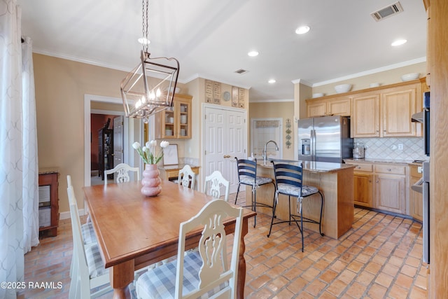 dining space with brick floor, recessed lighting, visible vents, and ornamental molding