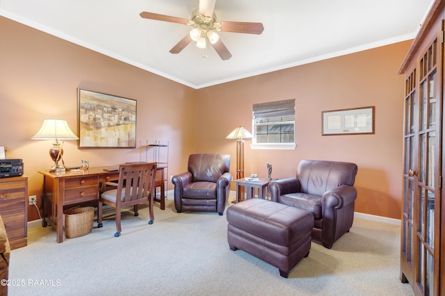 office space with ceiling fan, carpet flooring, baseboards, and ornamental molding