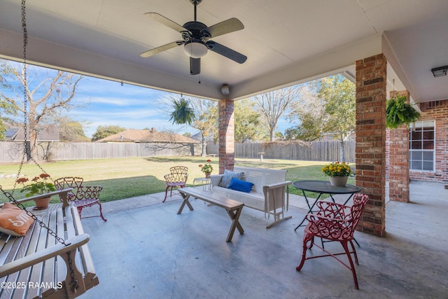 view of patio featuring a fenced backyard and a ceiling fan