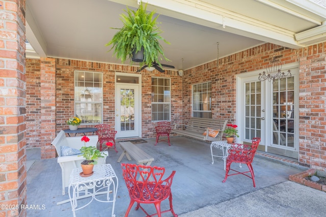 view of patio / terrace with french doors and a ceiling fan