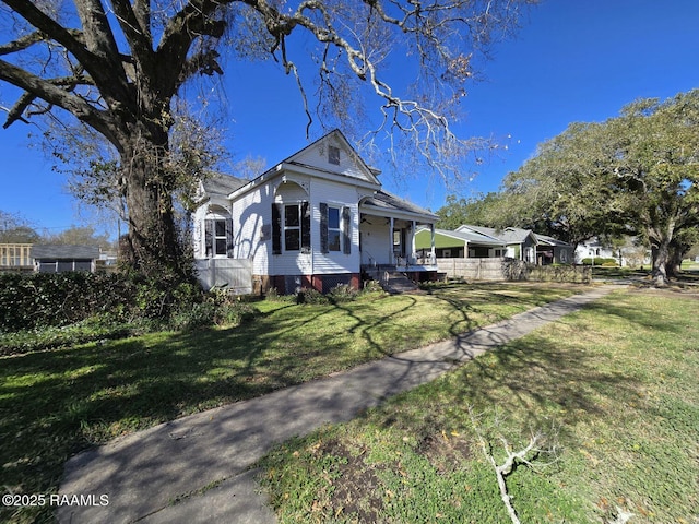 view of front of house featuring a front lawn and a porch