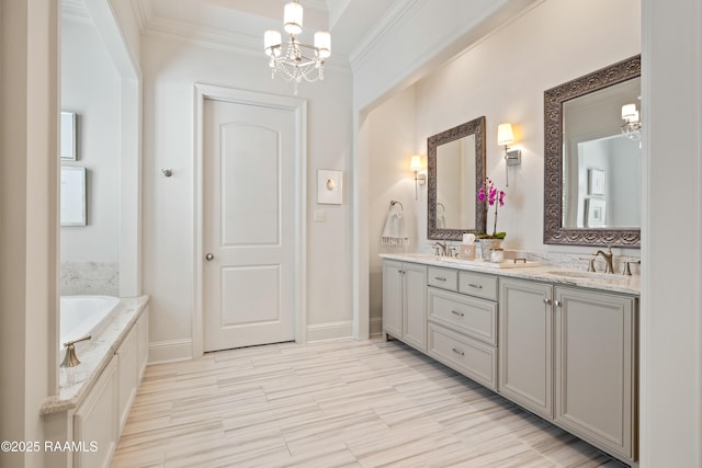 full bath featuring crown molding, a notable chandelier, a sink, and double vanity