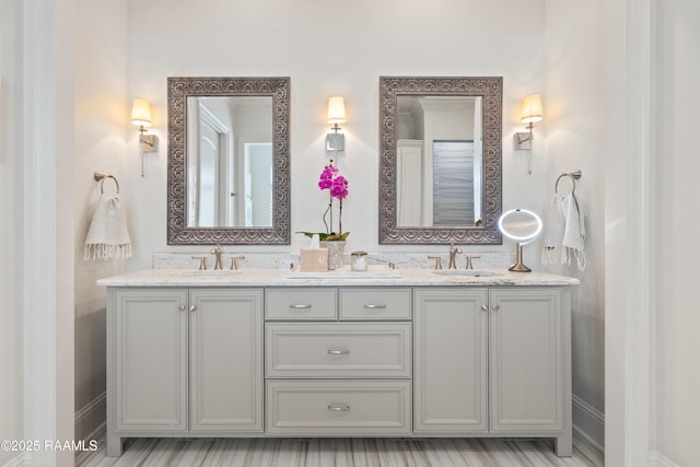 bathroom featuring double vanity and a sink