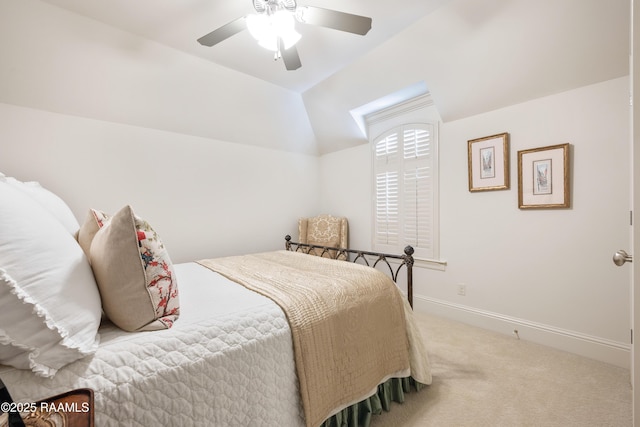 bedroom with lofted ceiling, ceiling fan, carpet flooring, and baseboards