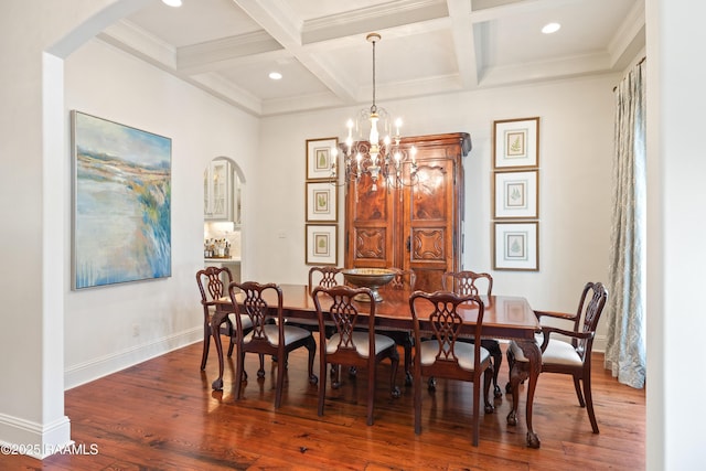 dining space with coffered ceiling, wood finished floors, beam ceiling, and baseboards