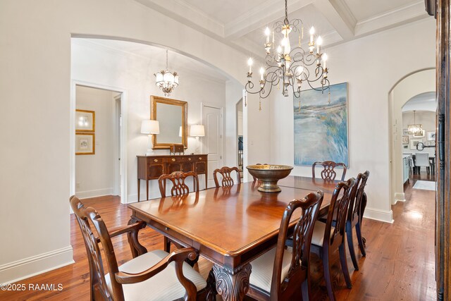 dining room with wood-type flooring, arched walkways, a chandelier, and beam ceiling