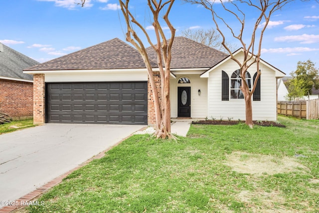 ranch-style home featuring roof with shingles, concrete driveway, a front yard, fence, and a garage