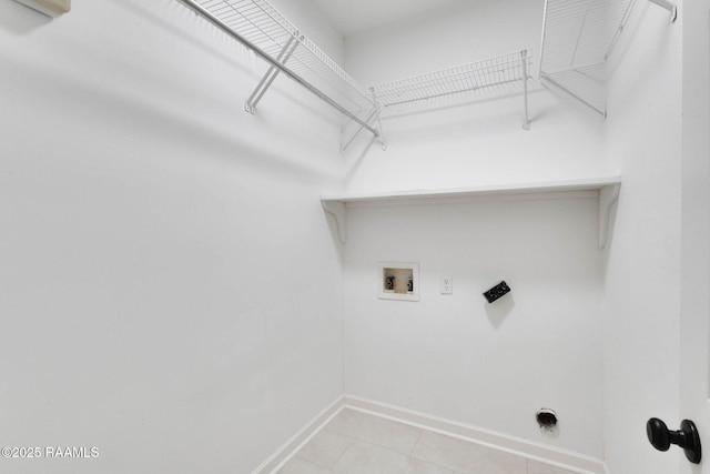 laundry room featuring light tile patterned floors, hookup for a washing machine, hookup for an electric dryer, laundry area, and baseboards