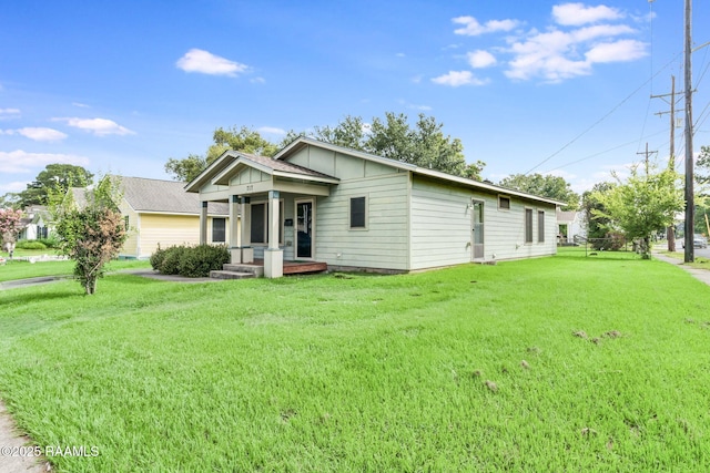 717 S Sterling St, Lafayette, LA 70501 - view of front of home featuring a front yard and board and batten siding