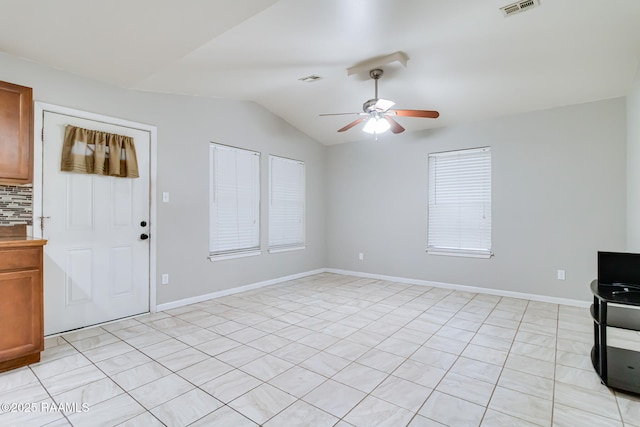 717 S Sterling St, Lafayette, LA 70501 - unfurnished living room featuring a ceiling fan, lofted ceiling, and light tile patterned floors