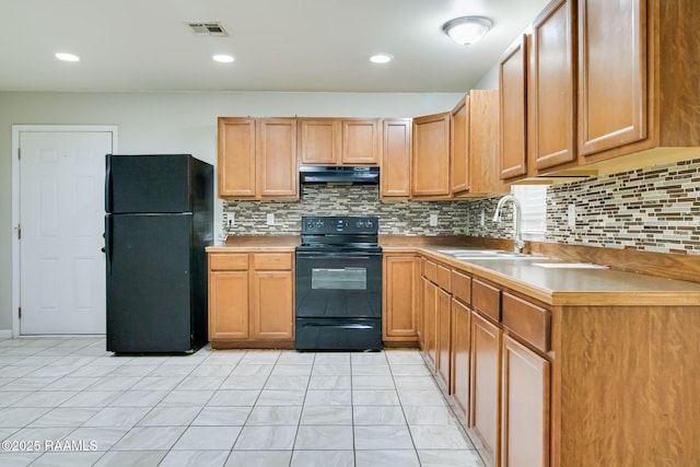 717 S Sterling St, Lafayette, LA 70501 - kitchen with black appliances, extractor fan, backsplash, light countertops, and recessed lighting