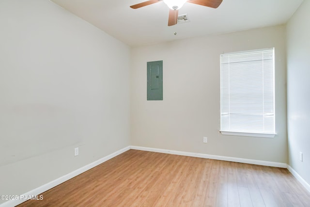 717 S Sterling St, Lafayette, LA 70501 - spare room with electric panel, light wood-style flooring, and a ceiling fan