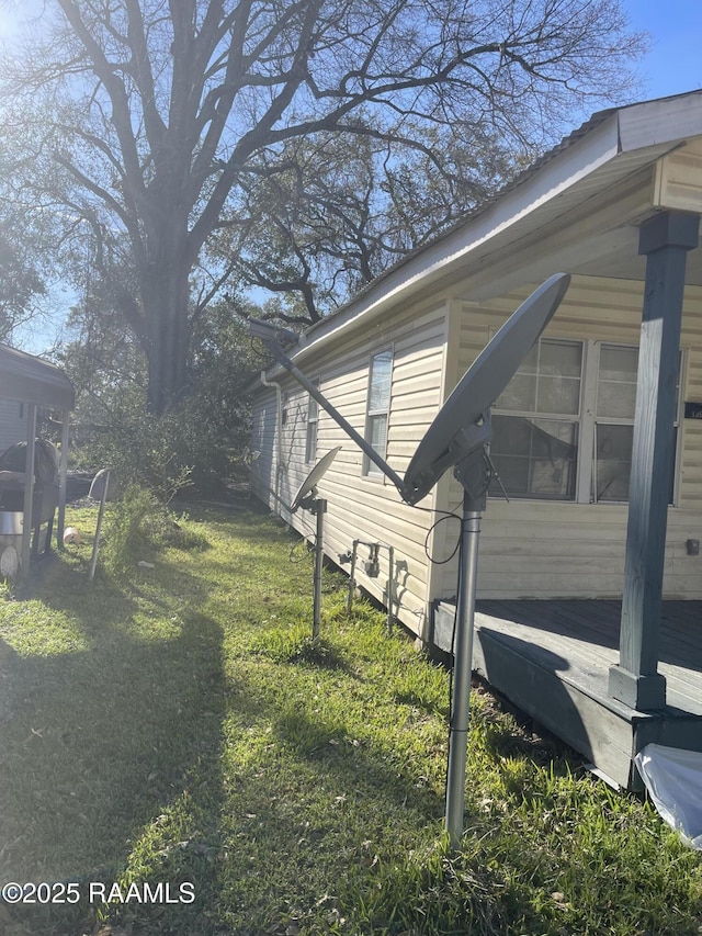 view of property exterior featuring a lawn