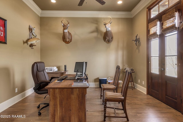 office with dark wood-style floors, ornamental molding, and baseboards