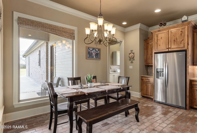 dining area featuring brick floor, baseboards, and ornamental molding