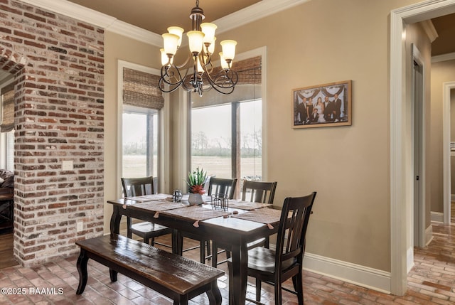 dining room featuring ornamental molding, brick floor, a notable chandelier, and baseboards