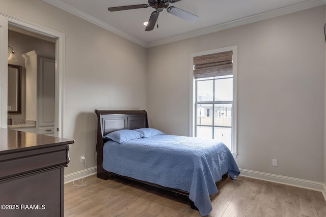 bedroom featuring ornamental molding, light wood-style floors, baseboards, and a ceiling fan